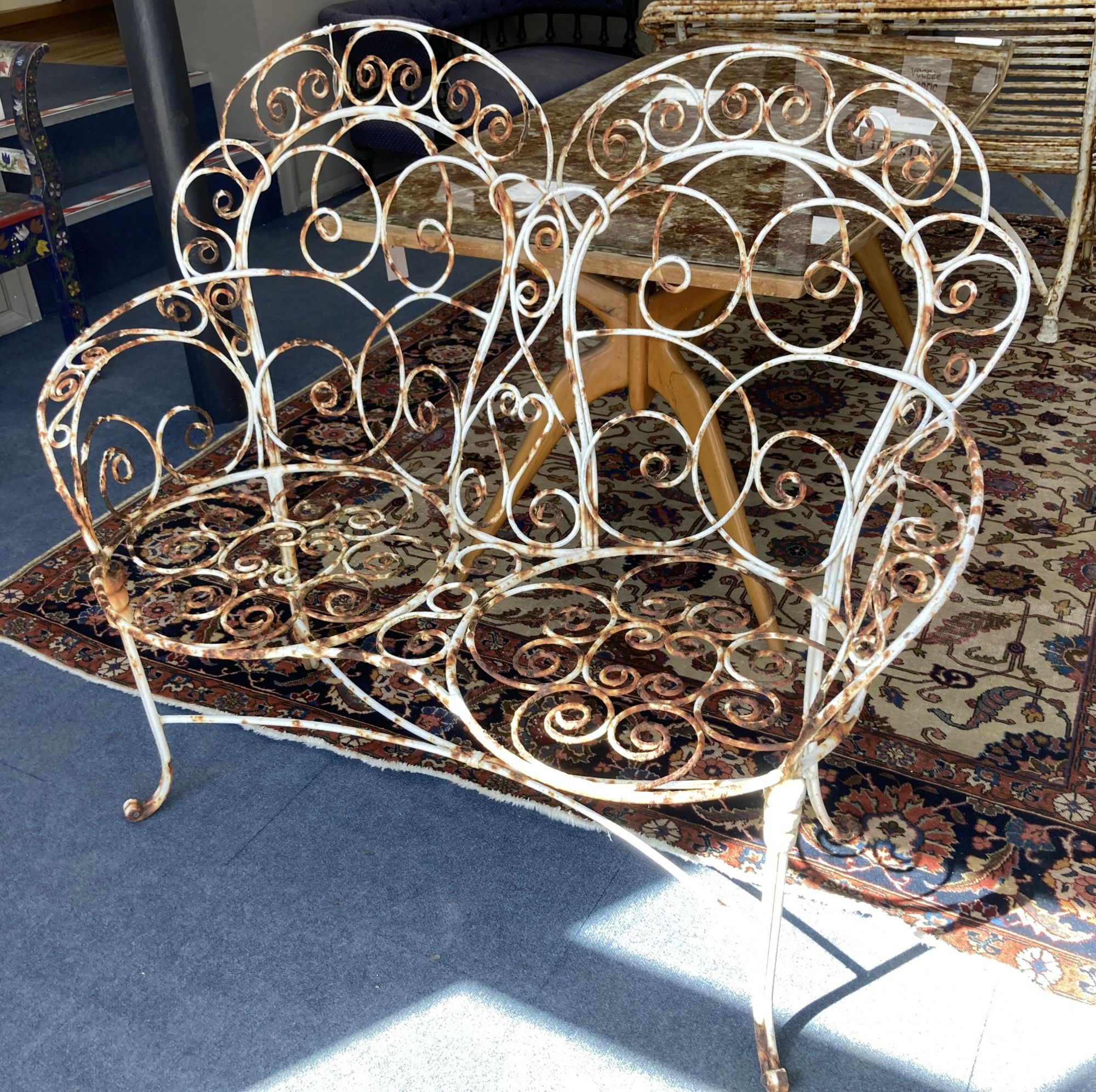 A vintage French wrought iron garden bench, length 120cm, depth 50cm, height 106cm